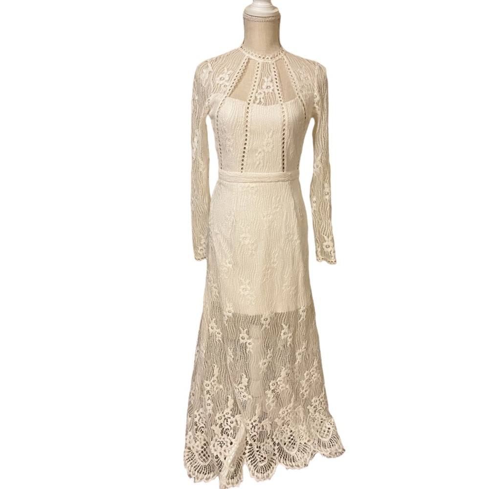 Alexis long sleeve lace evening gown. Fully lined.  Laced hem detail. Open back